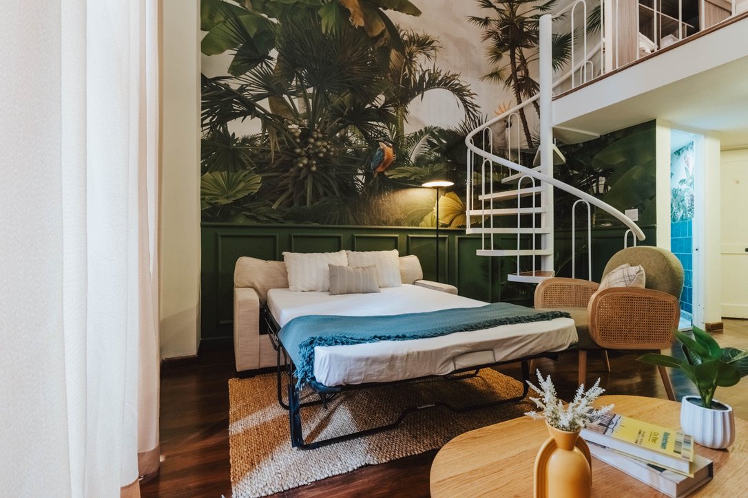 Double sofa bed set up in the living room of Plaza Catedral Loft
